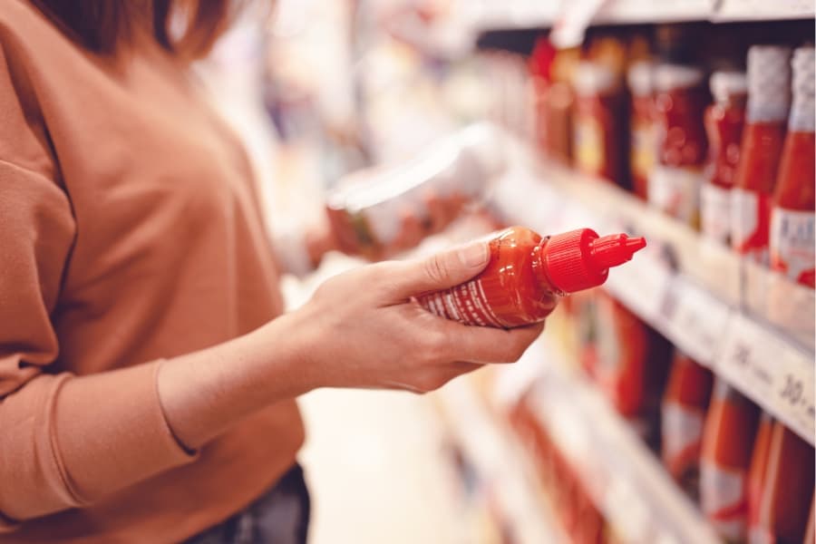 consumer evaluates product labels on packaging